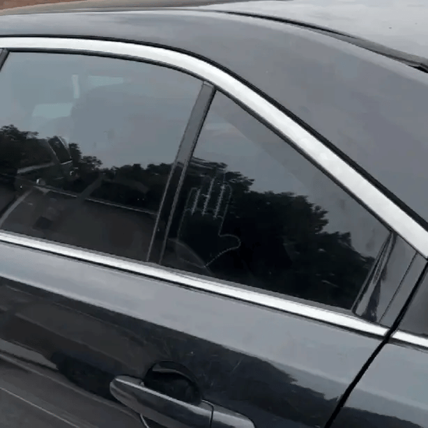 Road Buddy LED gesture light changing expressions inside a car window
