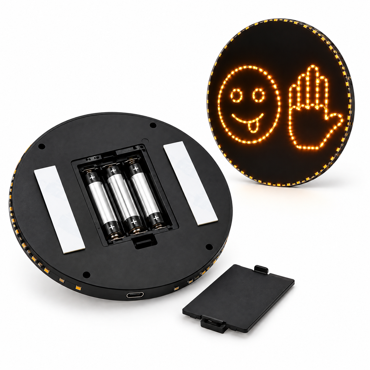 Road Buddy back view: 3x AA battery compartment, USB-C port and adhesive strips